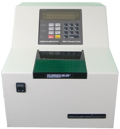 A DNA thermal cycler by Perkin Elmer Cetus, featuring a digital display and a keypad for programming.